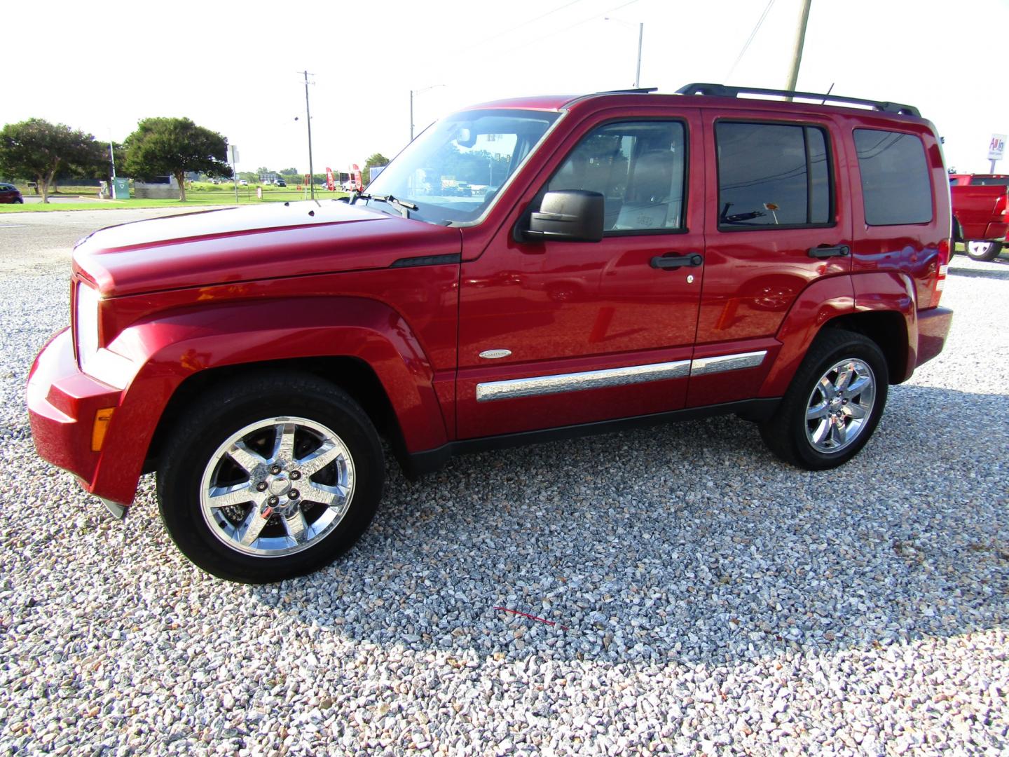 2012 Red /Black Jeep Liberty Sport 2WD (1C4PJLAK6CW) with an 3.7L V6 SOHC 12V engine, Automatic transmission, located at 15016 S Hwy 231, Midland City, AL, 36350, (334) 983-3001, 31.306210, -85.495277 - Photo#2