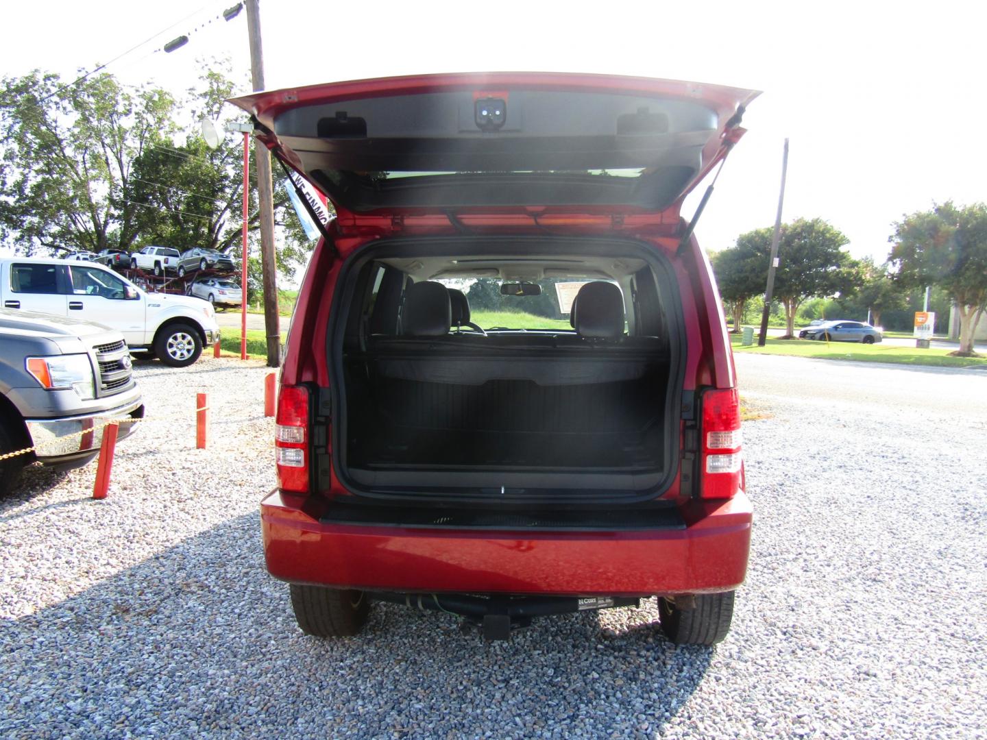 2012 Red /Black Jeep Liberty Sport 2WD (1C4PJLAK6CW) with an 3.7L V6 SOHC 12V engine, Automatic transmission, located at 15016 S Hwy 231, Midland City, AL, 36350, (334) 983-3001, 31.306210, -85.495277 - Photo#7