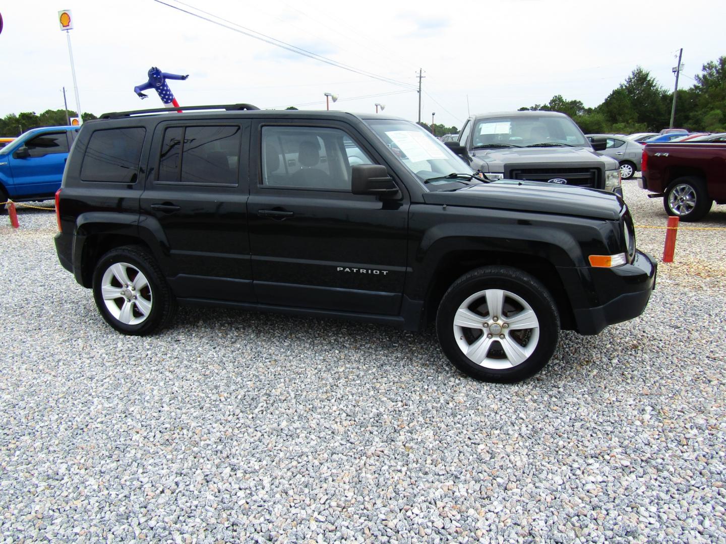 2013 DK GREEN /Gray Jeep Patriot Latitude 2WD (1C4NJPFBXDD) with an 2.4L L4 DOHC 16V engine, Automatic transmission, located at 15016 S Hwy 231, Midland City, AL, 36350, (334) 983-3001, 31.306210, -85.495277 - Photo#0