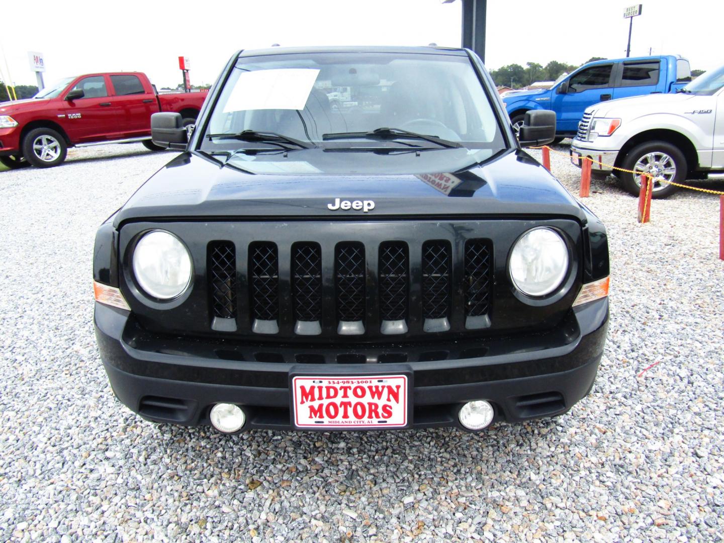 2013 DK GREEN /Gray Jeep Patriot Latitude 2WD (1C4NJPFBXDD) with an 2.4L L4 DOHC 16V engine, Automatic transmission, located at 15016 S Hwy 231, Midland City, AL, 36350, (334) 983-3001, 31.306210, -85.495277 - Photo#1