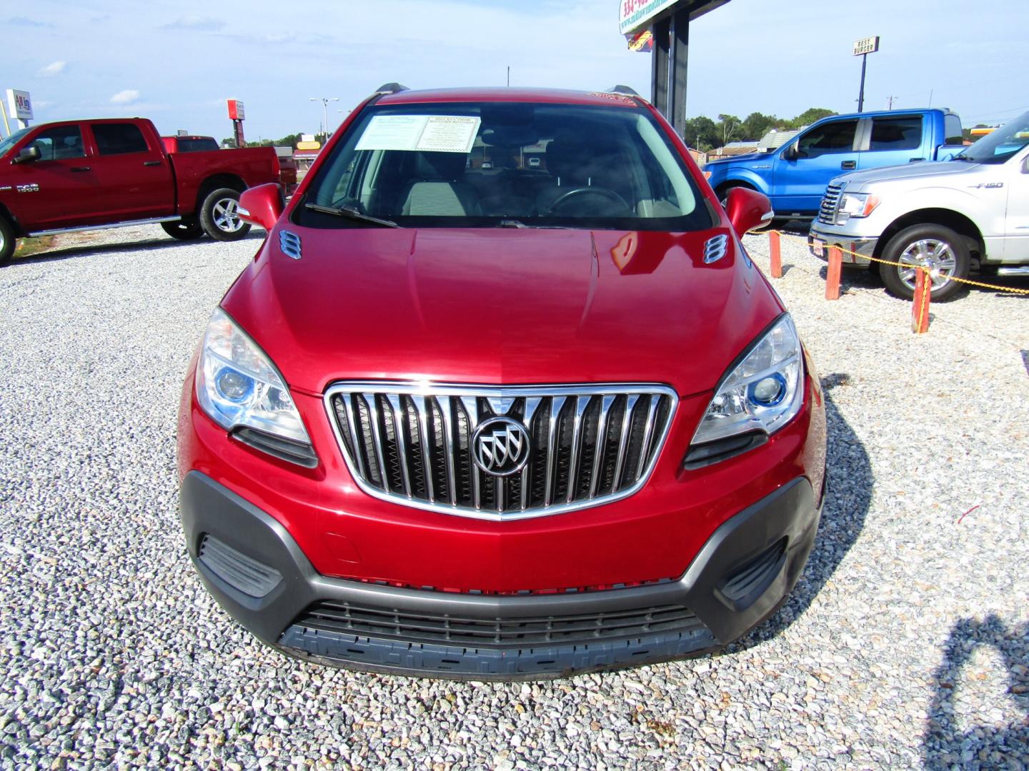 2015 Red Buick Encore Base FWD (KL4CJASB9FB) with an 1.4L L4 DOHC 16V TURBO engine, Automatic transmission, located at 15016 S Hwy 231, Midland City, AL, 36350, (334) 983-3001, 31.306210, -85.495277 - Photo#1