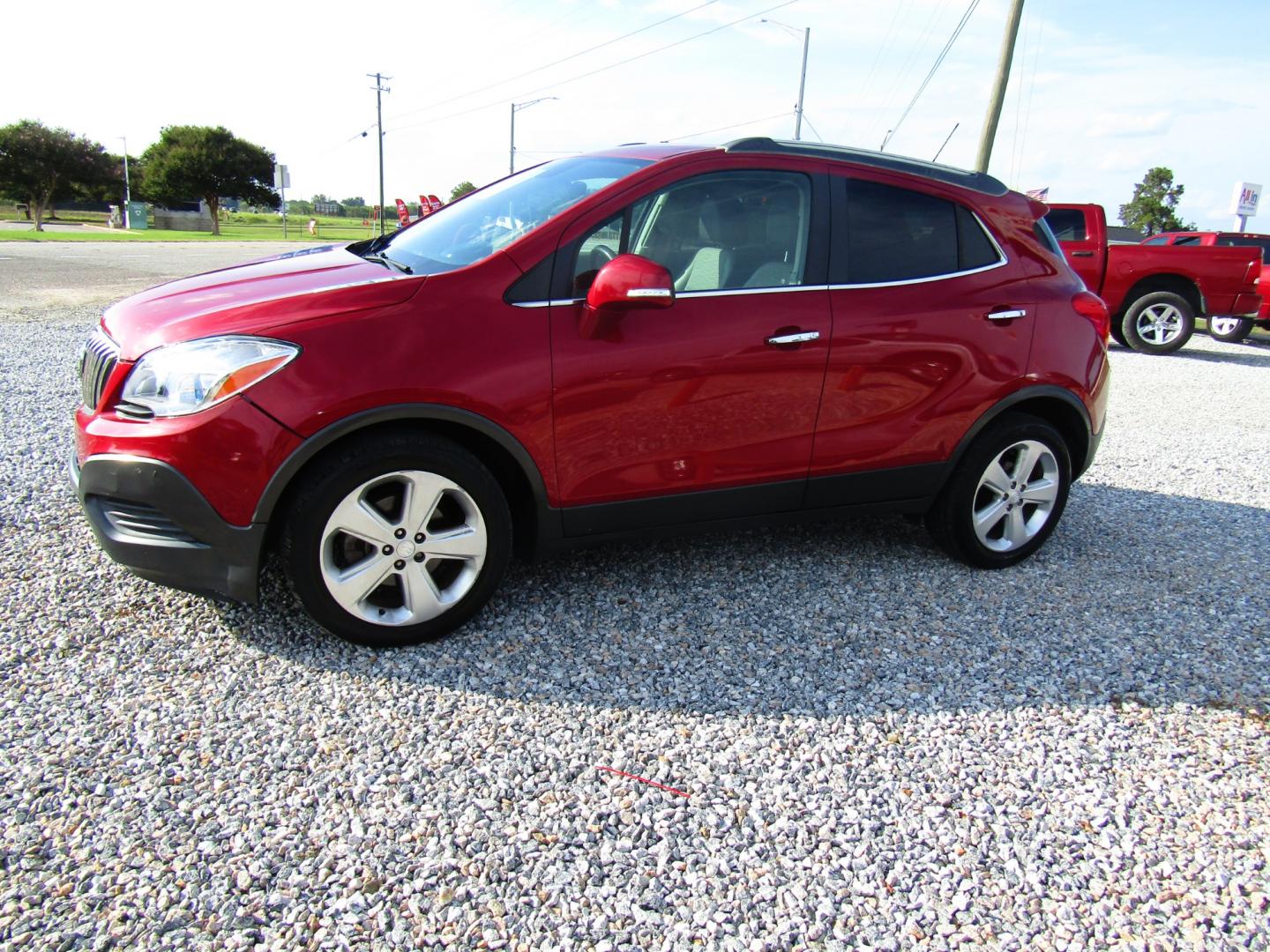 2015 Red Buick Encore Base FWD (KL4CJASB9FB) with an 1.4L L4 DOHC 16V TURBO engine, Automatic transmission, located at 15016 S Hwy 231, Midland City, AL, 36350, (334) 983-3001, 31.306210, -85.495277 - Photo#2