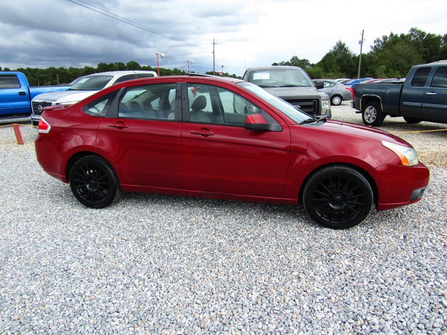 2009 Red /Gray Ford Focus SES Sedan (1FAHP36N59W) with an 2.0L L4 DOHC 16V engine, Automatic transmission, located at 15016 S Hwy 231, Midland City, AL, 36350, (334) 983-3001, 31.306210, -85.495277 - Photo#0