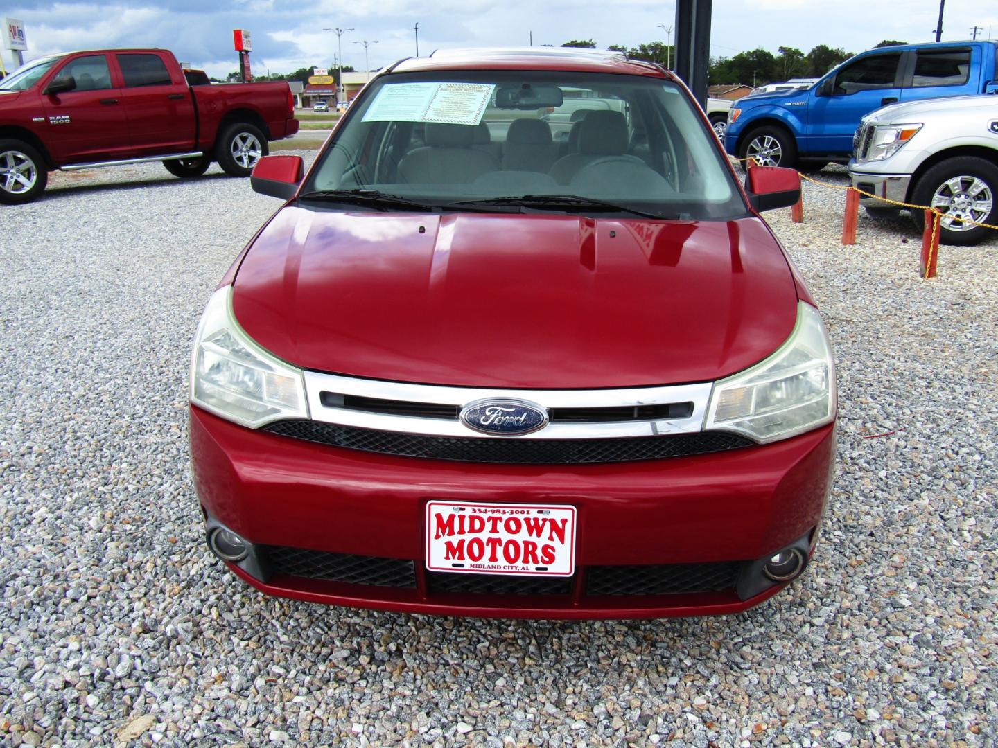 2009 Red /Gray Ford Focus SES Sedan (1FAHP36N59W) with an 2.0L L4 DOHC 16V engine, Automatic transmission, located at 15016 S Hwy 231, Midland City, AL, 36350, (334) 983-3001, 31.306210, -85.495277 - Photo#1