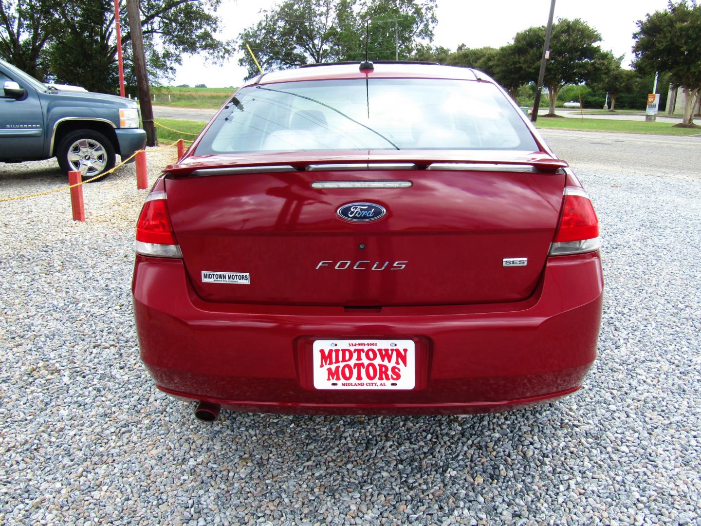 2009 Red /Gray Ford Focus SES Sedan (1FAHP36N59W) with an 2.0L L4 DOHC 16V engine, Automatic transmission, located at 15016 S Hwy 231, Midland City, AL, 36350, (334) 983-3001, 31.306210, -85.495277 - Photo#6