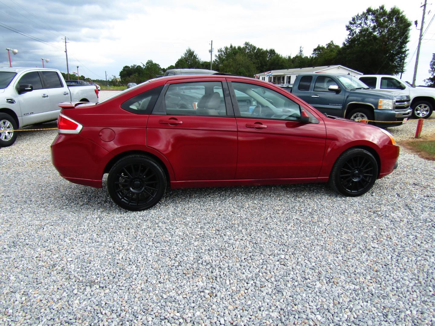 2009 Red /Gray Ford Focus SES Sedan (1FAHP36N59W) with an 2.0L L4 DOHC 16V engine, Automatic transmission, located at 15016 S Hwy 231, Midland City, AL, 36350, (334) 983-3001, 31.306210, -85.495277 - Photo#7