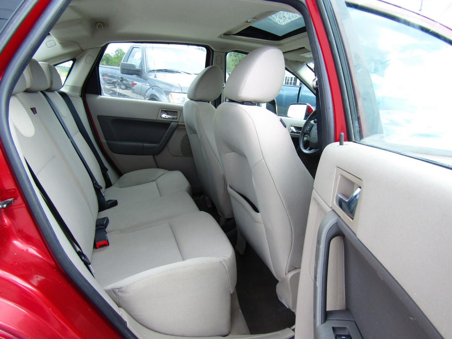 2009 Red /Gray Ford Focus SES Sedan (1FAHP36N59W) with an 2.0L L4 DOHC 16V engine, Automatic transmission, located at 15016 S Hwy 231, Midland City, AL, 36350, (334) 983-3001, 31.306210, -85.495277 - Photo#8