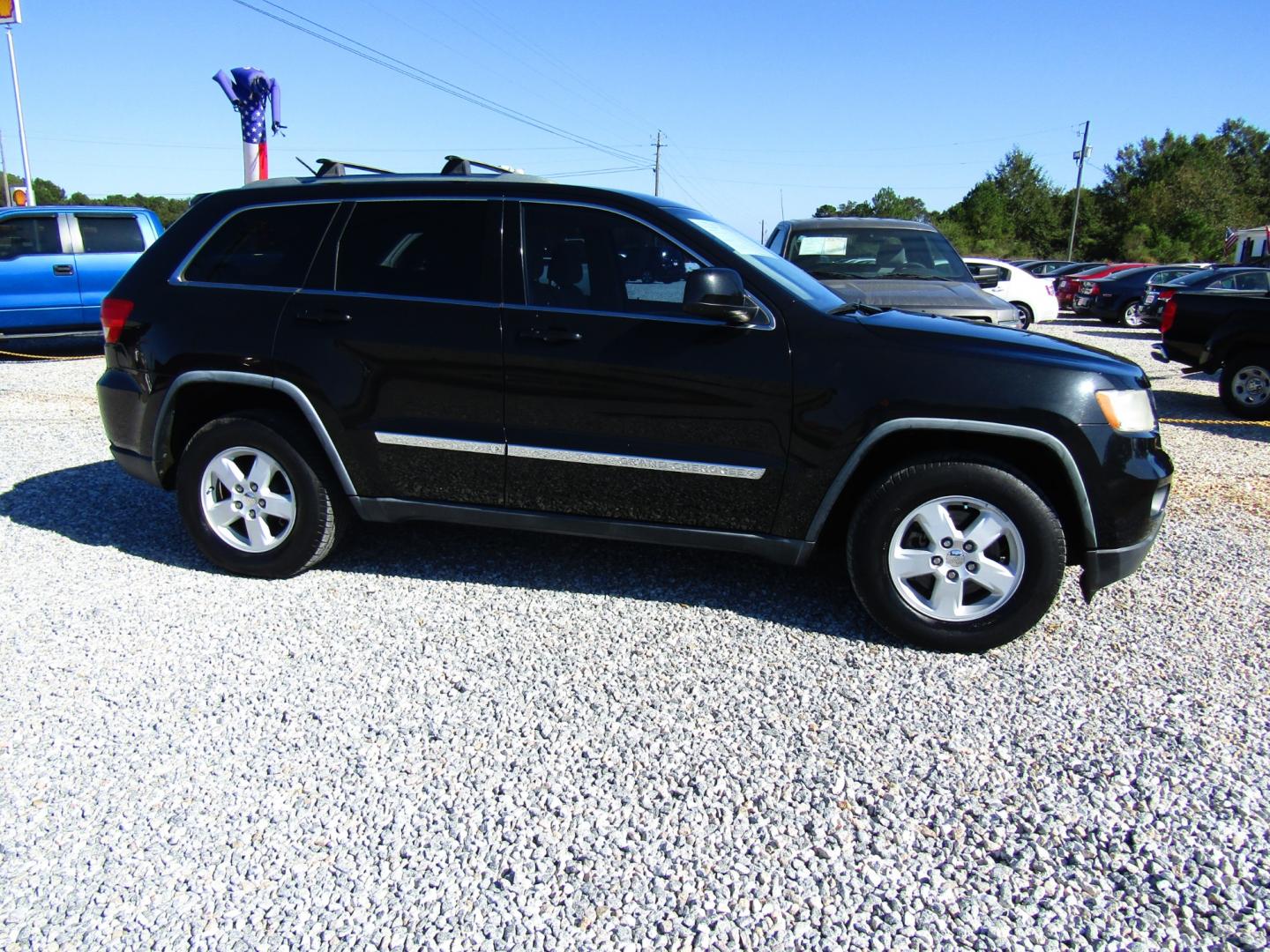 2012 Black /Tan Jeep Grand Cherokee Laredo 2WD (1C4RJEAG2CC) with an 3.6L V6 DOHC 24V engine, Automatic transmission, located at 15016 S Hwy 231, Midland City, AL, 36350, (334) 983-3001, 31.306210, -85.495277 - Photo#0