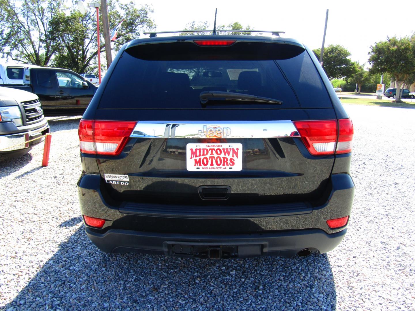 2012 Black /Tan Jeep Grand Cherokee Laredo 2WD (1C4RJEAG2CC) with an 3.6L V6 DOHC 24V engine, Automatic transmission, located at 15016 S Hwy 231, Midland City, AL, 36350, (334) 983-3001, 31.306210, -85.495277 - Photo#6