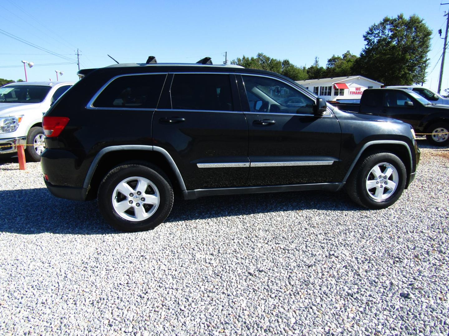 2012 Black /Tan Jeep Grand Cherokee Laredo 2WD (1C4RJEAG2CC) with an 3.6L V6 DOHC 24V engine, Automatic transmission, located at 15016 S Hwy 231, Midland City, AL, 36350, (334) 983-3001, 31.306210, -85.495277 - Photo#8