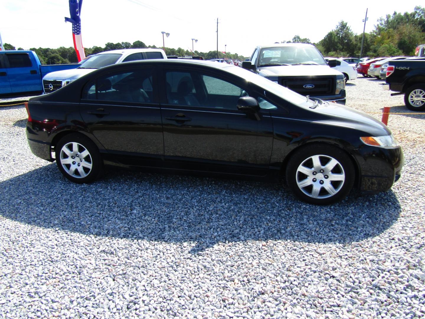 2009 Black /Gray Honda Civic LX Sedan 5-Speed AT (19XFA16589E) with an 1.8L L4 SOHC 16V engine, Automatic transmission, located at 15016 S Hwy 231, Midland City, AL, 36350, (334) 983-3001, 31.306210, -85.495277 - Photo#0