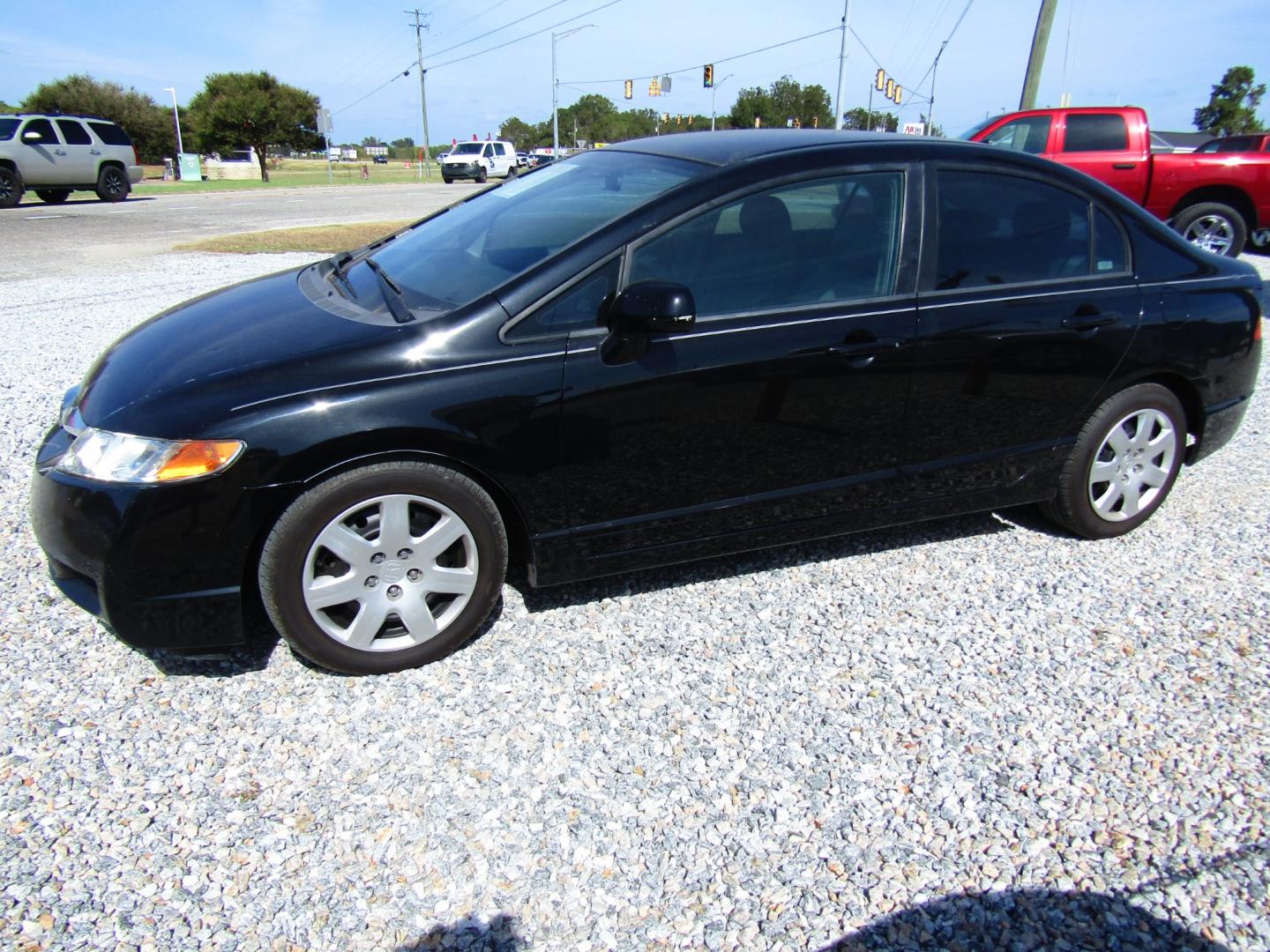 2009 Black /Gray Honda Civic LX Sedan 5-Speed AT (19XFA16589E) with an 1.8L L4 SOHC 16V engine, Automatic transmission, located at 15016 S Hwy 231, Midland City, AL, 36350, (334) 983-3001, 31.306210, -85.495277 - Photo#2