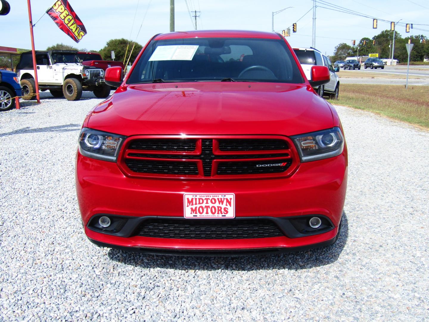 2014 Red /Black Dodge Durango SXT RWD (1C4RDHAG9EC) with an 3.6L V6 DOHC 24V engine, Automatic transmission, located at 15016 S Hwy 231, Midland City, AL, 36350, (334) 983-3001, 31.306210, -85.495277 - Photo#1