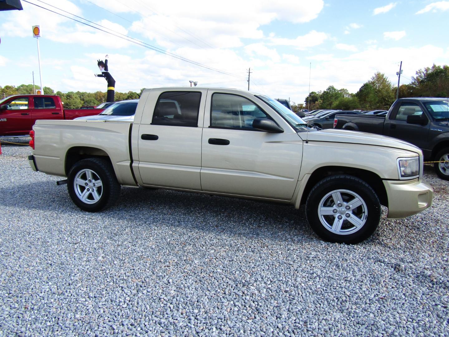 2011 Gold Dodge Dakota SXT Crew Cab 2WD (1D7RE3GK5BS) with an 3.7L V6 SOHC 12V engine, Automatic transmission, located at 15016 S Hwy 231, Midland City, AL, 36350, (334) 983-3001, 31.306210, -85.495277 - Photo#0