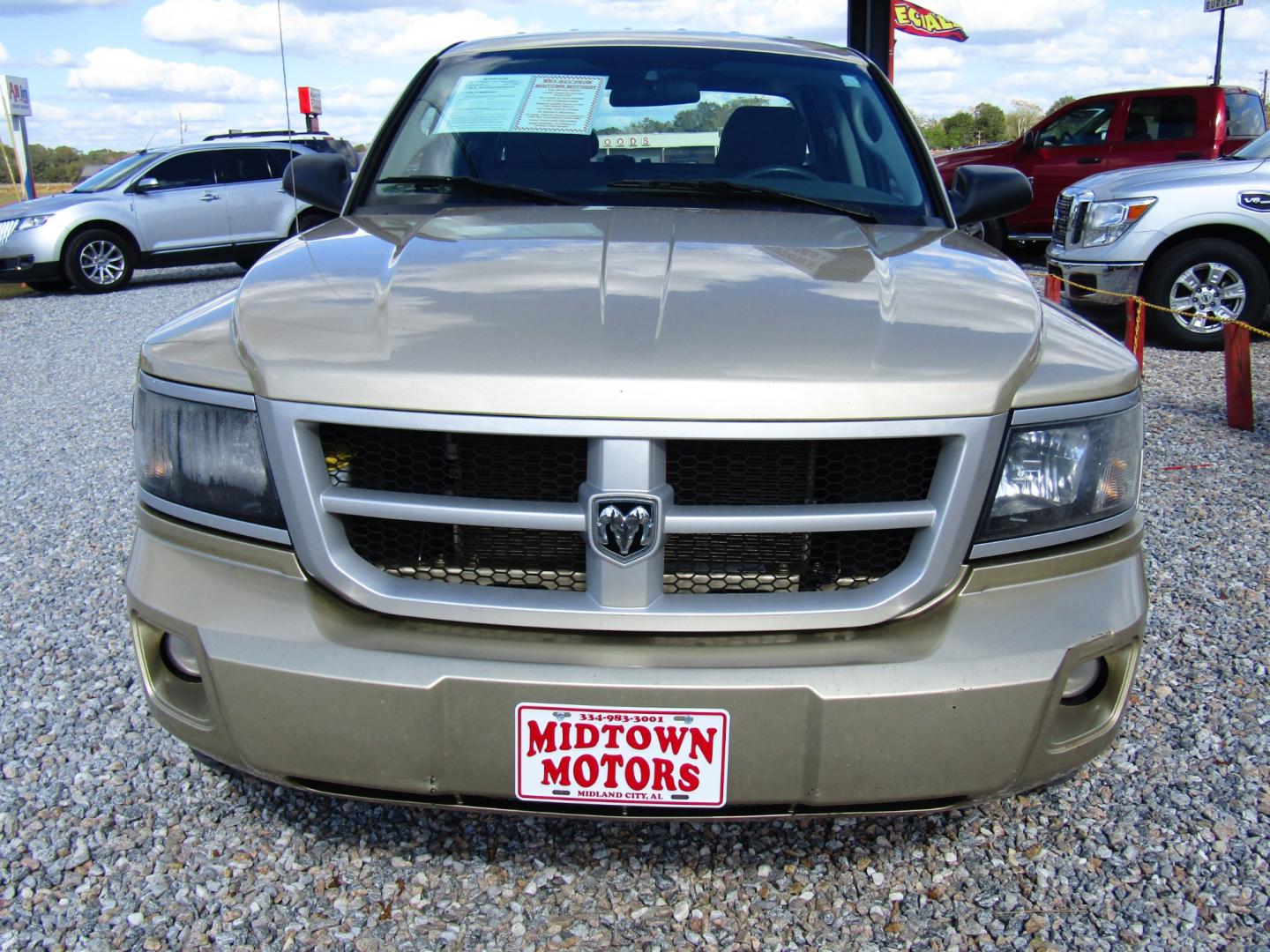 2011 Gold Dodge Dakota SXT Crew Cab 2WD (1D7RE3GK5BS) with an 3.7L V6 SOHC 12V engine, Automatic transmission, located at 15016 S Hwy 231, Midland City, AL, 36350, (334) 983-3001, 31.306210, -85.495277 - Photo#1