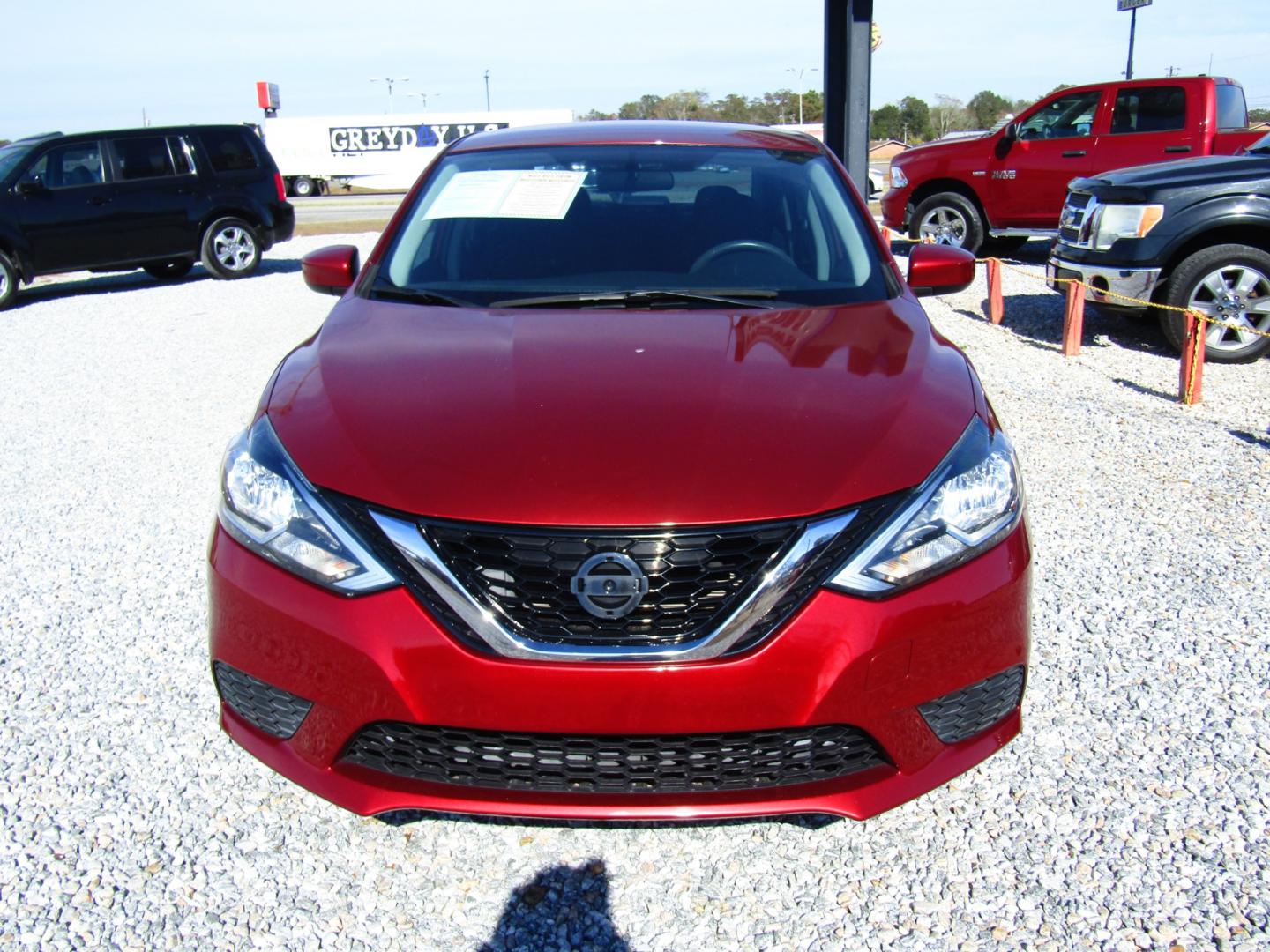 2017 Red /Black Nissan Sentra S 6MT (3N1AB7AP1HY) with an 1.8L L4 SFI DOHC 16V engine, Automatic transmission, located at 15016 S Hwy 231, Midland City, AL, 36350, (334) 983-3001, 31.306210, -85.495277 - Photo#1