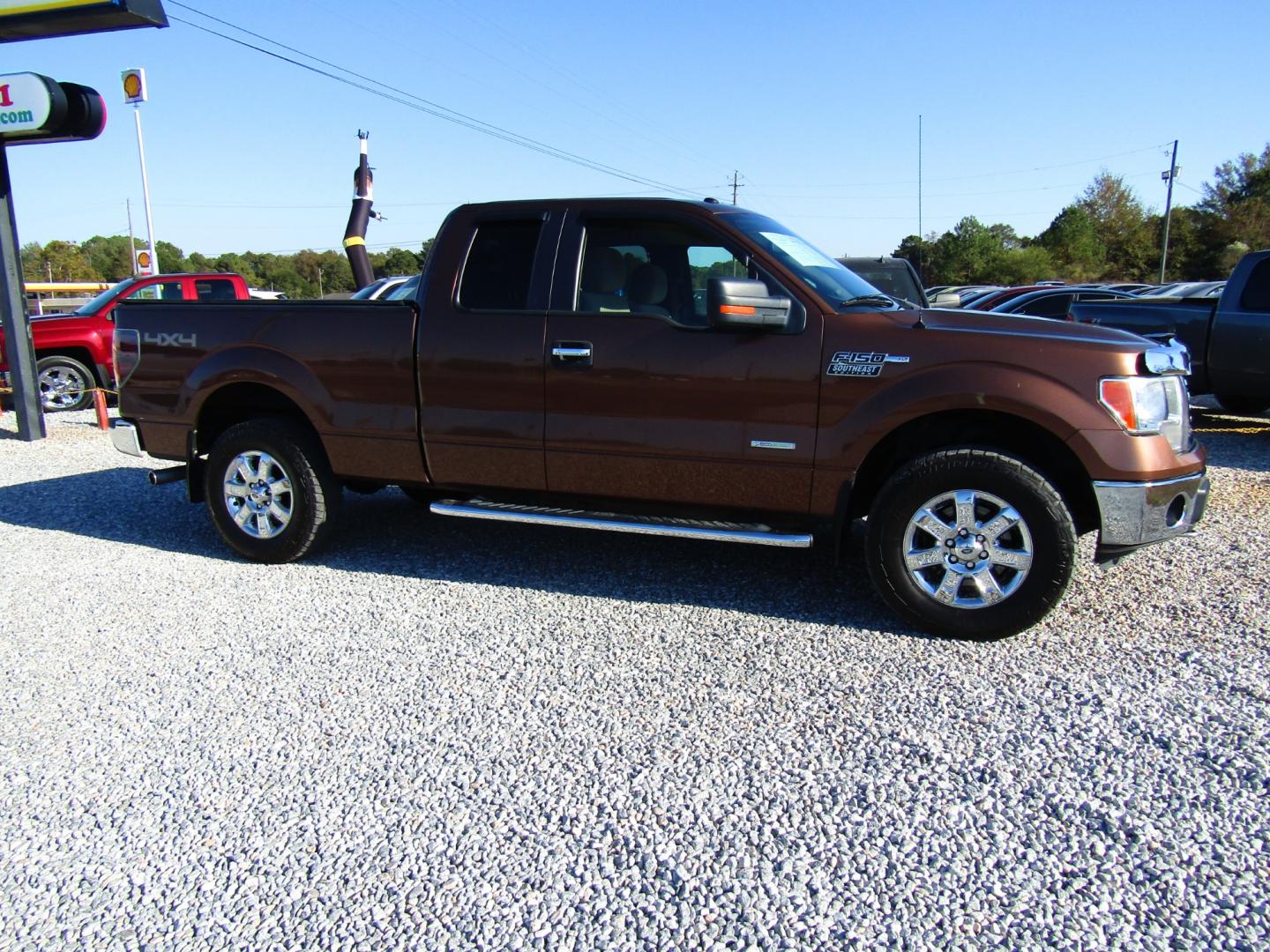 2012 Brown /Tan Ford F-150 FX4 SuperCab 6.5-ft. Bed 4WD (1FTFX1ET3CF) with an 3.5L V6 TURBO engine, Automatic transmission, located at 15016 S Hwy 231, Midland City, AL, 36350, (334) 983-3001, 31.306210, -85.495277 - Photo#0