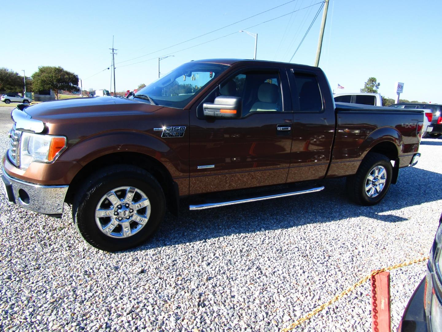 2012 Brown /Tan Ford F-150 FX4 SuperCab 6.5-ft. Bed 4WD (1FTFX1ET3CF) with an 3.5L V6 TURBO engine, Automatic transmission, located at 15016 S Hwy 231, Midland City, AL, 36350, (334) 983-3001, 31.306210, -85.495277 - Photo#2