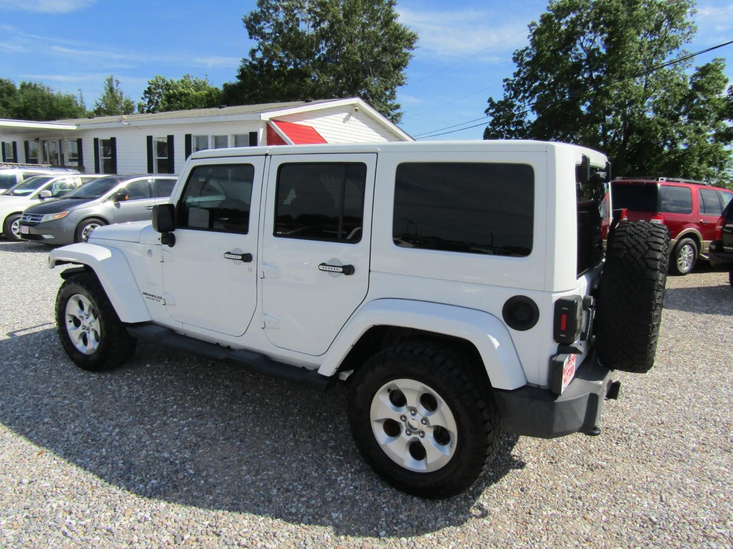 2014 White Jeep Wrangler (1C4BJWEG0EL) with an V6 engine, Automatic transmission, located at 15016 S Hwy 231, Midland City, AL, 36350, (334) 983-3001, 31.306210, -85.495277 - Photo#5