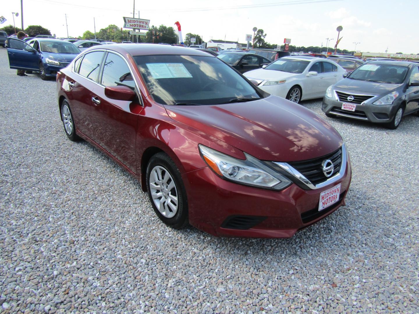 2016 Red /Gray Nissan Altima 2.5 SL (1N4AL3AP3GN) with an 2.5L L4 DOHC 16V engine, Automatic transmission, located at 15016 S Hwy 231, Midland City, AL, 36350, (334) 983-3001, 31.306210, -85.495277 - Photo#0