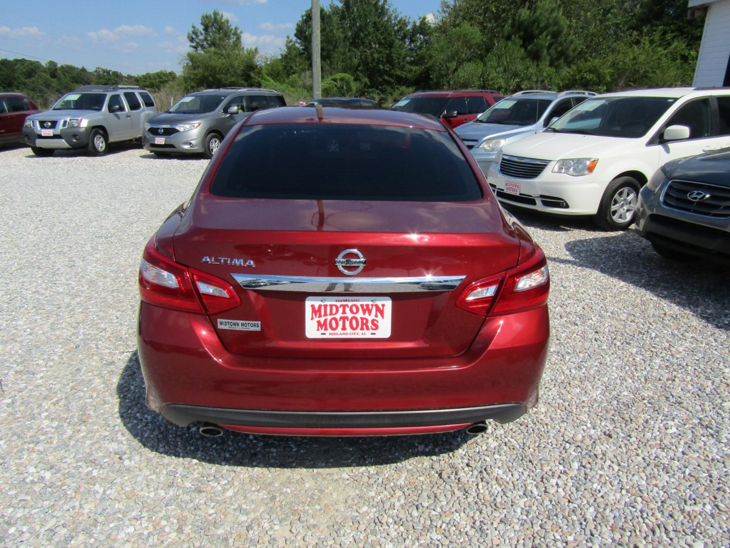 2016 Red /Gray Nissan Altima 2.5 SL (1N4AL3AP3GN) with an 2.5L L4 DOHC 16V engine, Automatic transmission, located at 15016 S Hwy 231, Midland City, AL, 36350, (334) 983-3001, 31.306210, -85.495277 - Photo#6