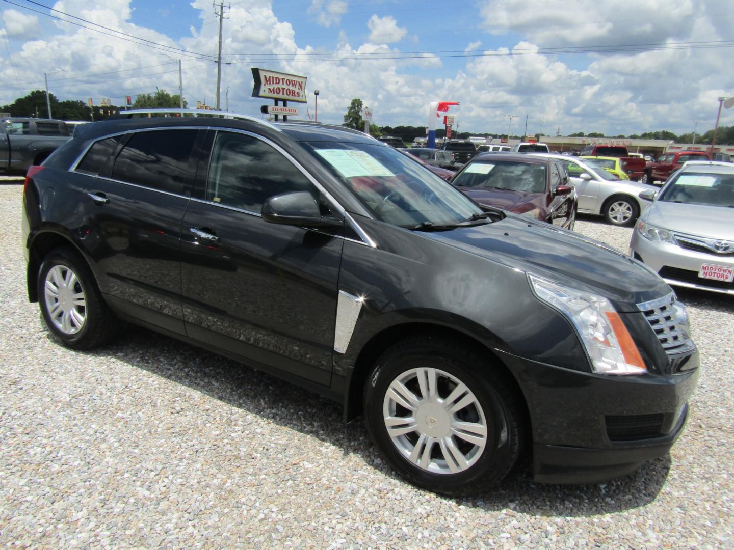 2015 Gray /Gray Cadillac SRX Luxury Collection FWD (3GYFNBE34FS) with an 3.6L V6 DOHC 24V FFV engine, Automatic transmission, located at 15016 S Hwy 231, Midland City, AL, 36350, (334) 983-3001, 31.306210, -85.495277 - Photo#0