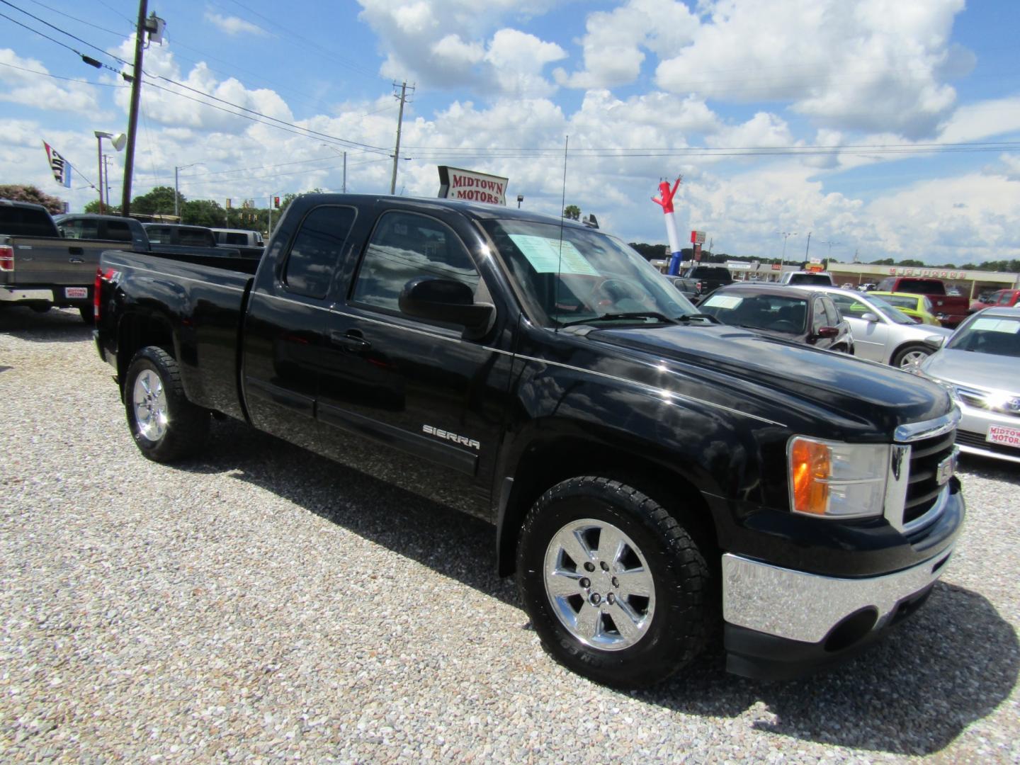 2011 Black GMC Sierra 1500 SLT Ext. Cab 4WD (1GTR2WE32BZ) with an 5.3L V8 OHV 16V FFV engine, Automatic transmission, located at 15016 S Hwy 231, Midland City, AL, 36350, (334) 983-3001, 31.306210, -85.495277 - Photo#0