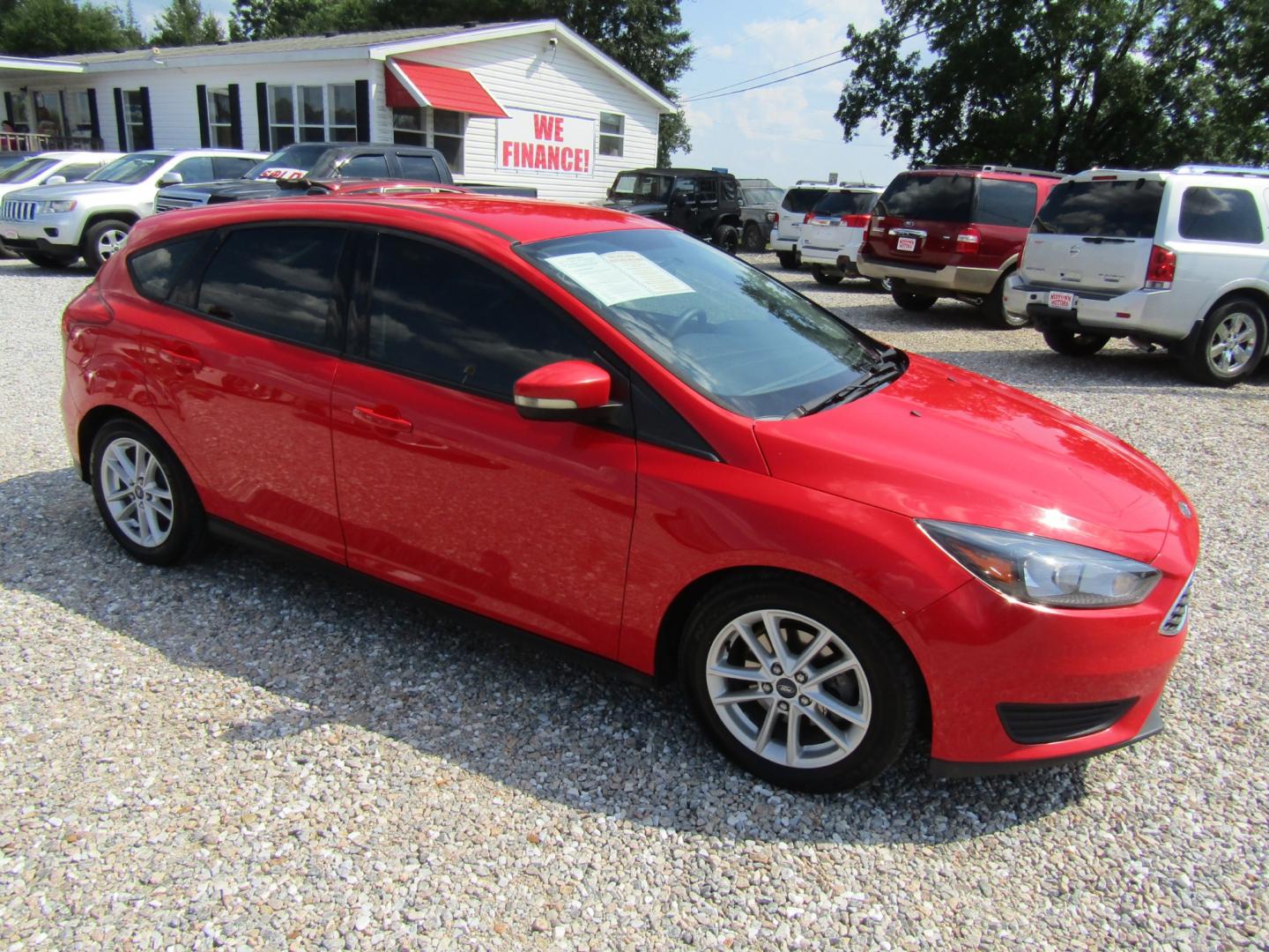 2015 Red /Gray Ford Focus SE Hatch (1FADP3K29FL) with an 2.0L L4 DOHC 16V engine, Automatic transmission, located at 15016 S Hwy 231, Midland City, AL, 36350, (334) 983-3001, 31.306210, -85.495277 - Photo#0