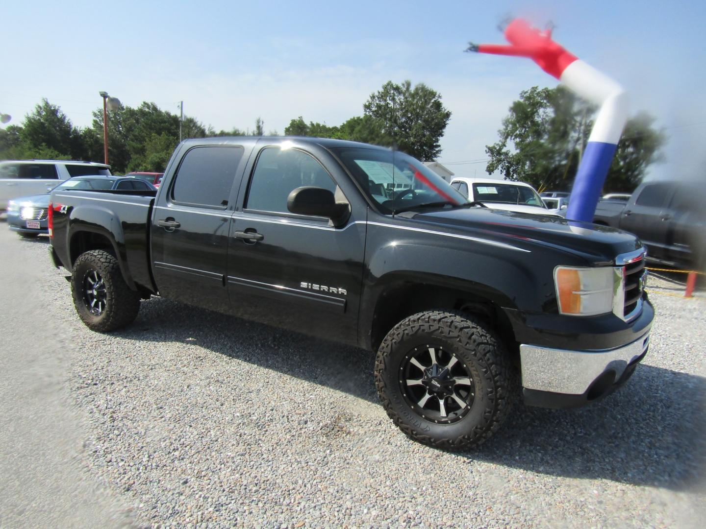 2010 Black /Gray GMC Sierra 1500 SLE Crew Cab 4WD (3GTRKVE3XAG) with an 5.3L V8 OHV 16V FFV engine, 4-Speed Automatic transmission, located at 15016 S Hwy 231, Midland City, AL, 36350, (334) 983-3001, 31.306210, -85.495277 - Photo#0