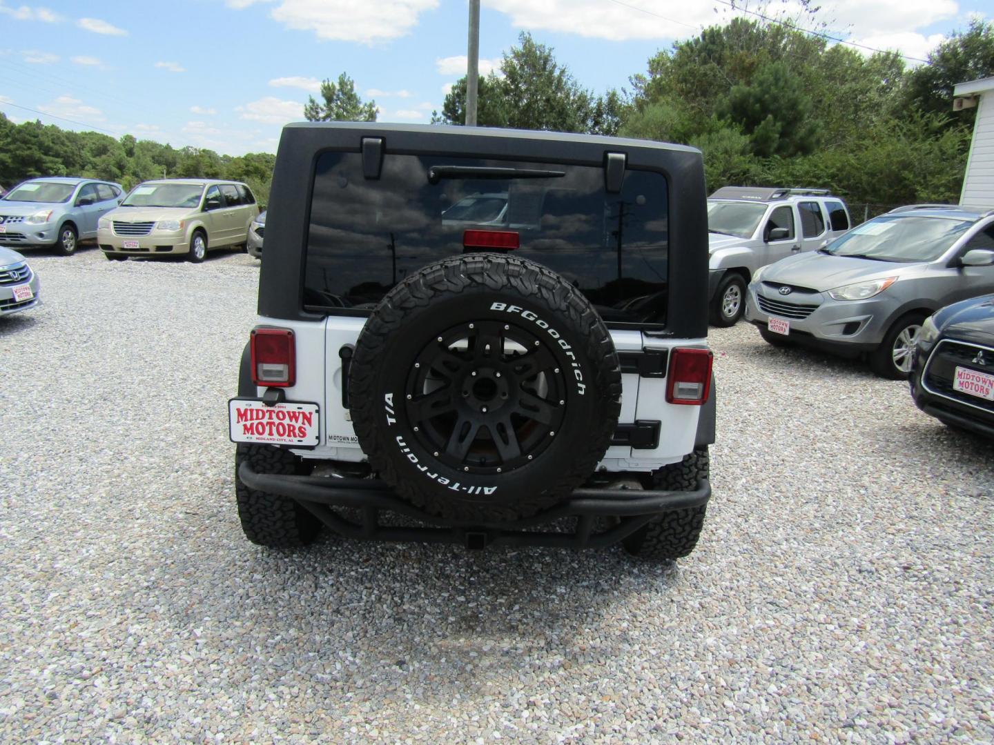 2012 White Jeep Wrangler Sport 4WD (1C4AJWAG6CL) with an 3.6L V6 DOHC 24V FFV engine, Automatic transmission, located at 15016 S Hwy 231, Midland City, AL, 36350, (334) 983-3001, 31.306210, -85.495277 - Photo#5