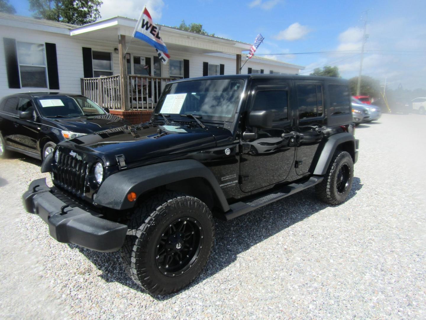 2016 Black Jeep Wrangler Unlimited Sport 4WD (1C4BJWDG9GL) with an 3.6L V6 DOHC 24V FFV engine, Automatic transmission, located at 15016 S Hwy 231, Midland City, AL, 36350, (334) 983-3001, 31.306210, -85.495277 - Photo#2