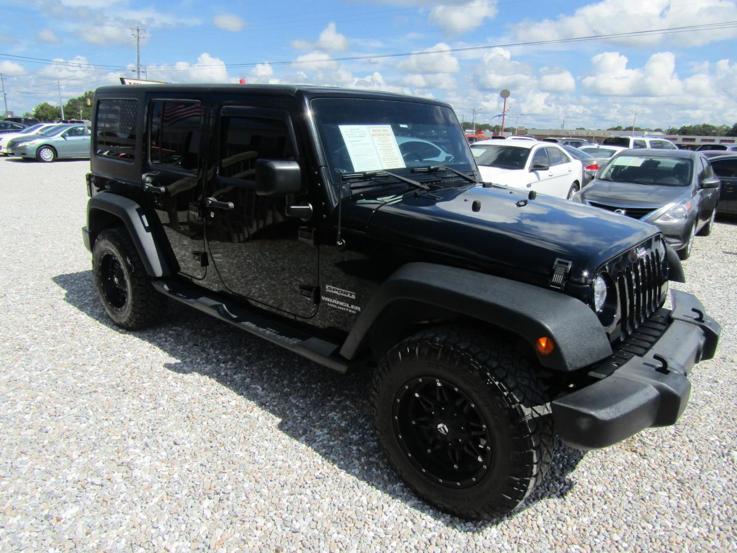 2016 Black Jeep Wrangler Unlimited Sport 4WD (1C4BJWDG9GL) with an 3.6L V6 DOHC 24V FFV engine, Automatic transmission, located at 15016 S Hwy 231, Midland City, AL, 36350, (334) 983-3001, 31.306210, -85.495277 - Photo#0