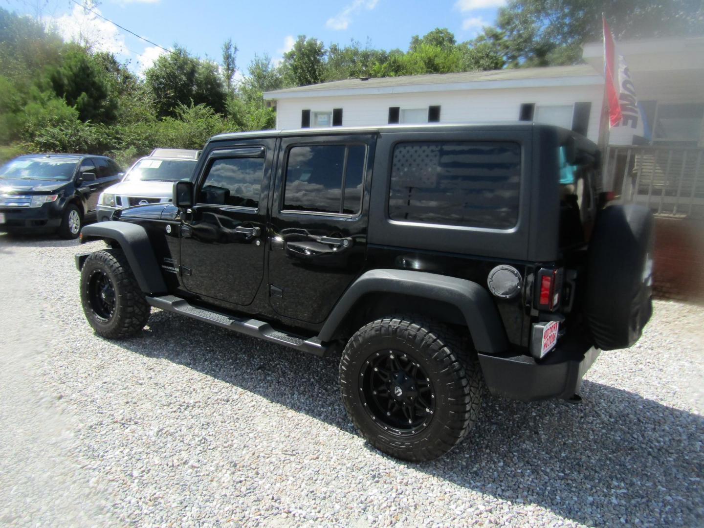 2016 Black Jeep Wrangler Unlimited Sport 4WD (1C4BJWDG9GL) with an 3.6L V6 DOHC 24V FFV engine, Automatic transmission, located at 15016 S Hwy 231, Midland City, AL, 36350, (334) 983-3001, 31.306210, -85.495277 - Photo#5