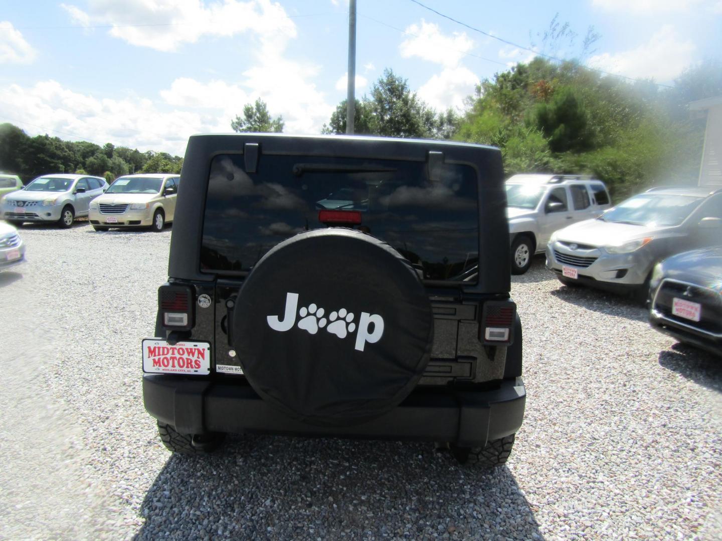 2016 Black Jeep Wrangler Unlimited Sport 4WD (1C4BJWDG9GL) with an 3.6L V6 DOHC 24V FFV engine, Automatic transmission, located at 15016 S Hwy 231, Midland City, AL, 36350, (334) 983-3001, 31.306210, -85.495277 - Photo#6