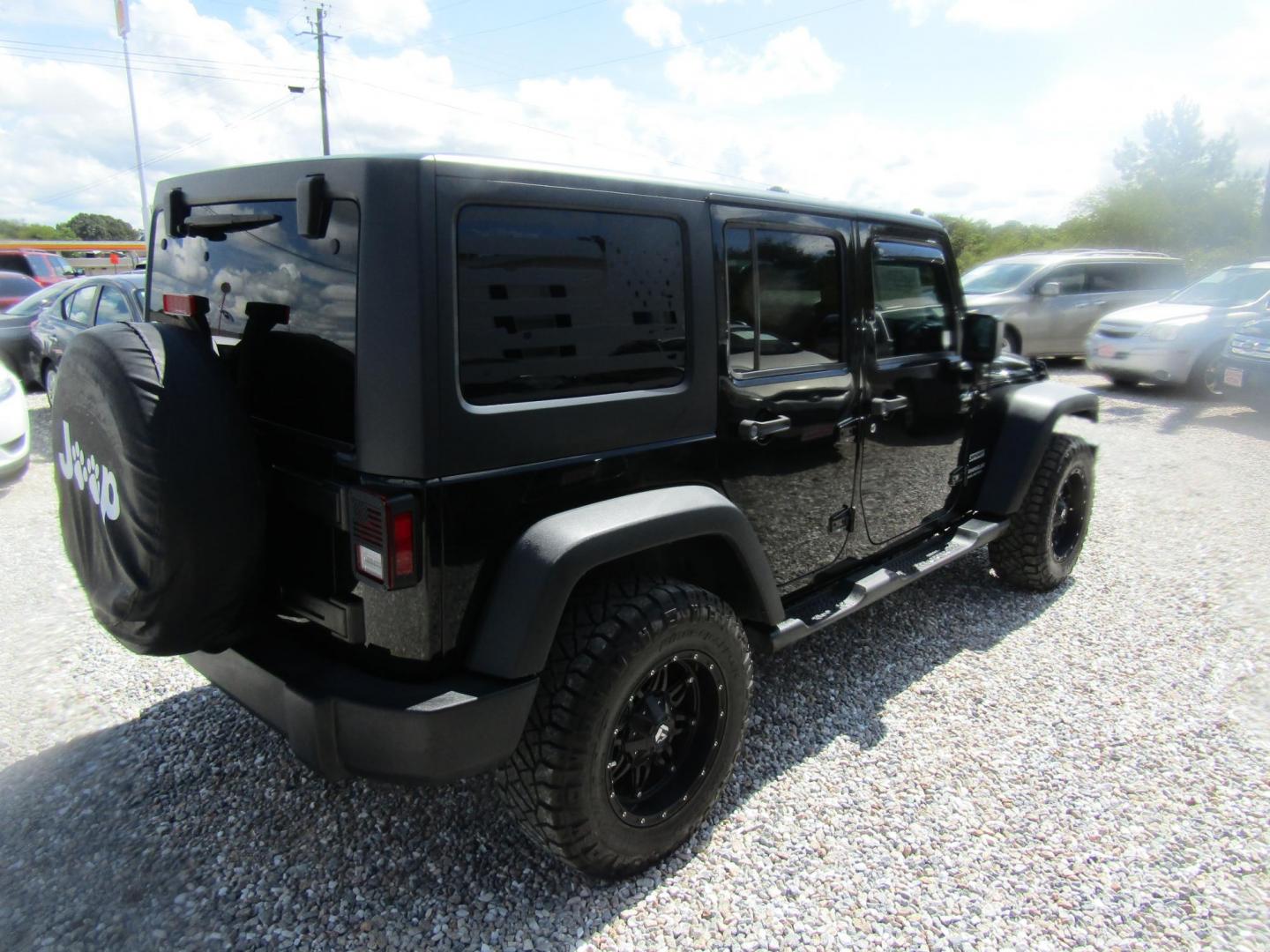 2016 Black Jeep Wrangler Unlimited Sport 4WD (1C4BJWDG9GL) with an 3.6L V6 DOHC 24V FFV engine, Automatic transmission, located at 15016 S Hwy 231, Midland City, AL, 36350, (334) 983-3001, 31.306210, -85.495277 - Photo#7