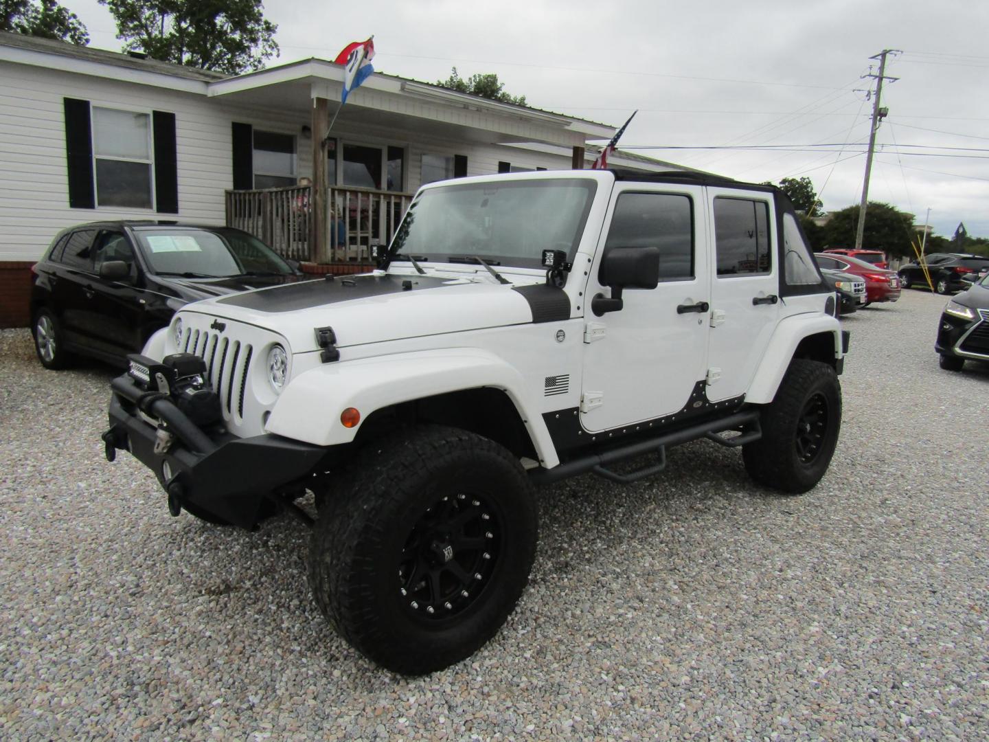 2014 White Jeep Wrangler Unlimited Sahara 4WD (1C4BJWEG0EL) with an 3.6L V6 DOHC 24V FFV engine, Automatic transmission, located at 15016 S Hwy 231, Midland City, AL, 36350, (334) 983-3001, 31.306210, -85.495277 - Photo#2