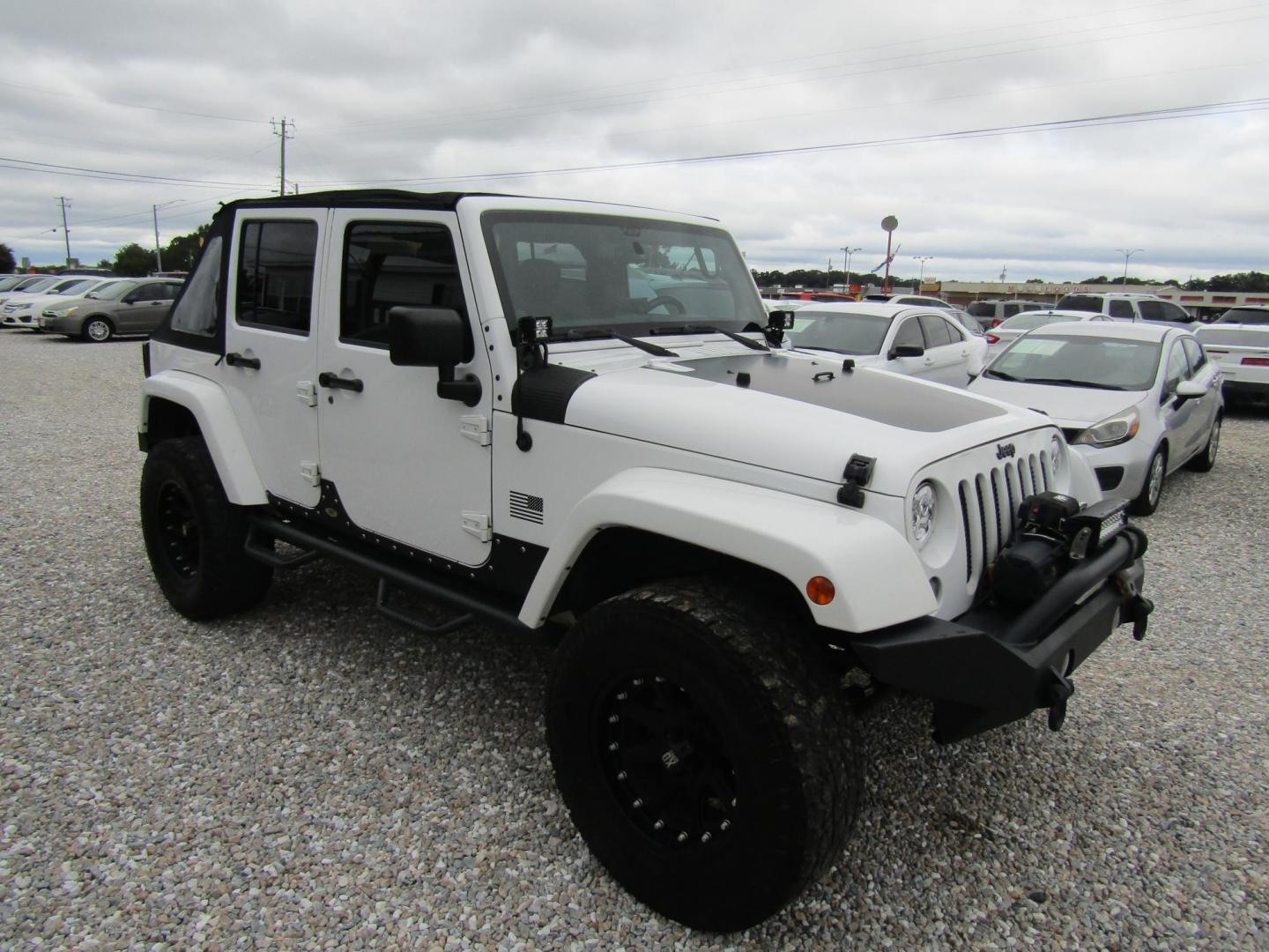 2014 White Jeep Wrangler Unlimited Sahara 4WD (1C4BJWEG0EL) with an 3.6L V6 DOHC 24V FFV engine, Automatic transmission, located at 15016 S Hwy 231, Midland City, AL, 36350, (334) 983-3001, 31.306210, -85.495277 - Photo#0