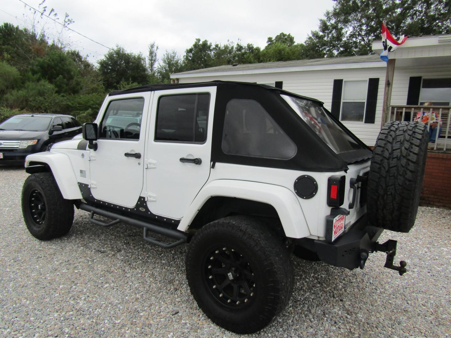 2014 White Jeep Wrangler Unlimited Sahara 4WD (1C4BJWEG0EL) with an 3.6L V6 DOHC 24V FFV engine, Automatic transmission, located at 15016 S Hwy 231, Midland City, AL, 36350, (334) 983-3001, 31.306210, -85.495277 - Photo#5