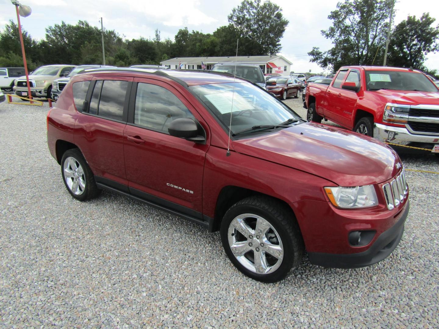 2013 Red Jeep Compass Limited FWD (1C4NJCCBXDD) with an 2.4L L4 DOHC 16V engine, Automatic transmission, located at 15016 S Hwy 231, Midland City, AL, 36350, (334) 983-3001, 31.306210, -85.495277 - Photo#0