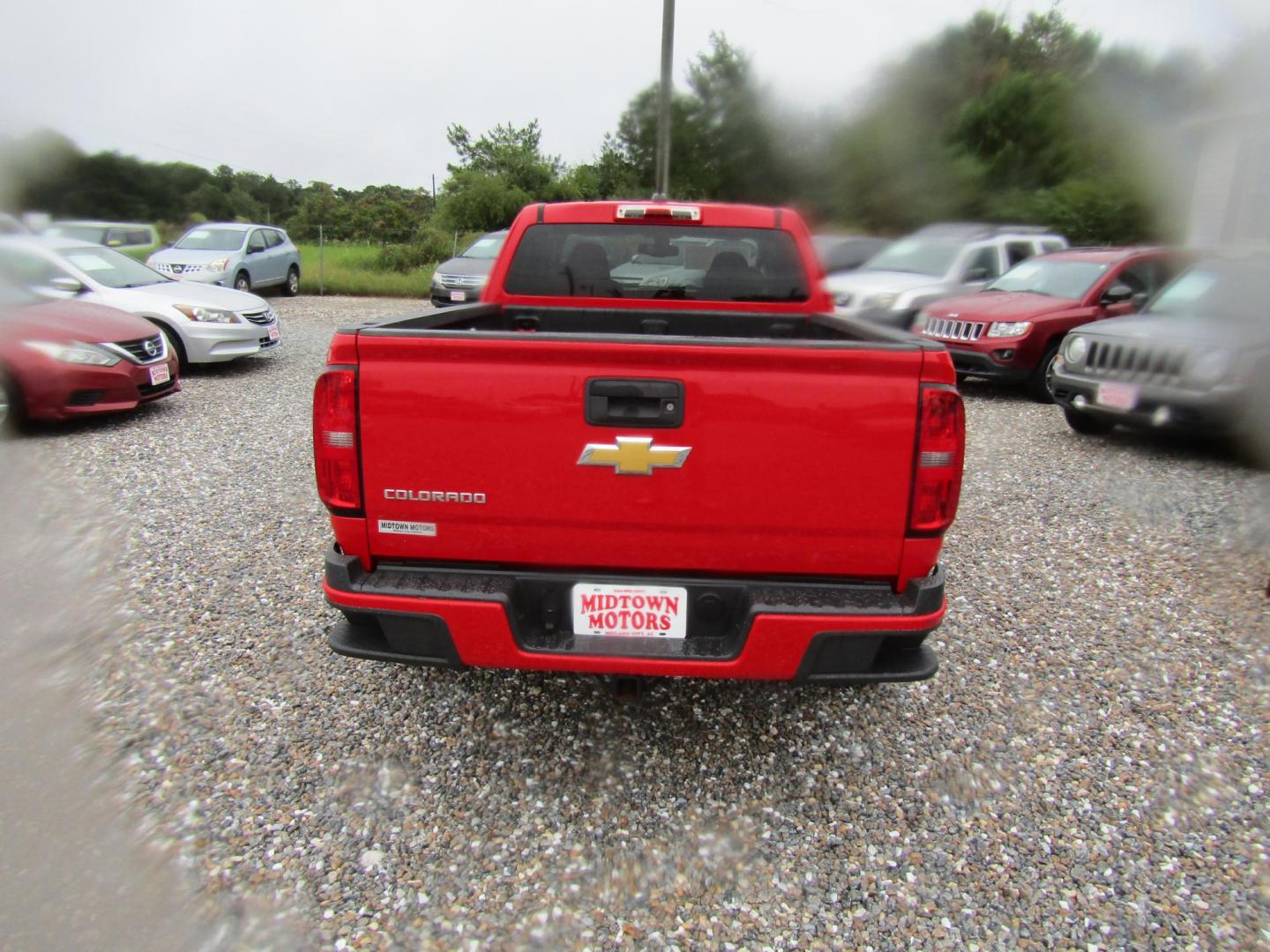 2015 Red Chevrolet Colorado WT Ext. Cab 2WD (1GCHSAE39F1) with an 3.6L V6 DOHC 24V GAS engine, Automatic transmission, located at 15016 S Hwy 231, Midland City, AL, 36350, (334) 983-3001, 31.306210, -85.495277 - Photo#7