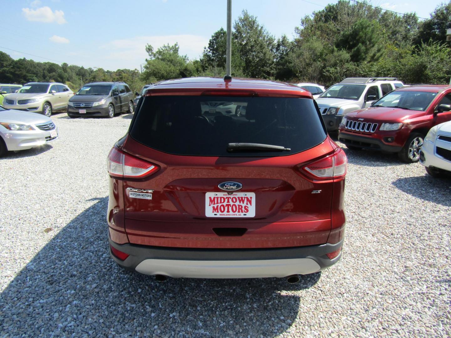 2015 Burgandy Ford Escape SE FWD (1FMCU0G72FU) with an 2.5L L4 DOHC 16V engine, Automatic transmission, located at 15016 S Hwy 231, Midland City, AL, 36350, (334) 983-3001, 31.306210, -85.495277 - Photo#6