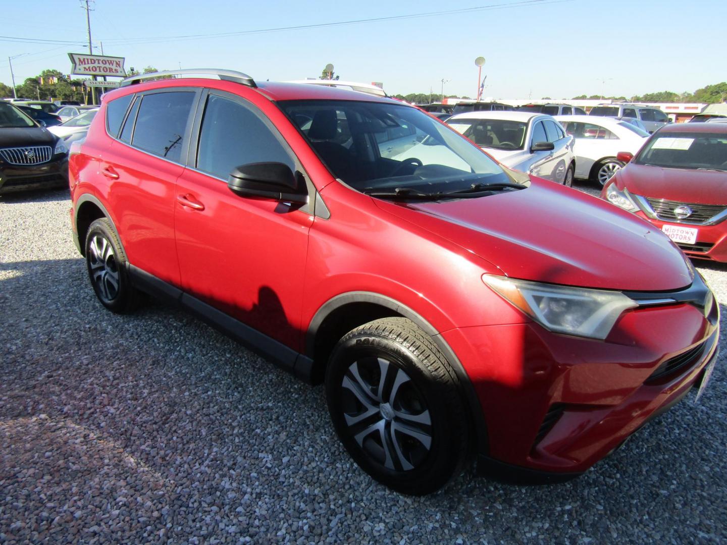 2017 Red Toyota RAV4 LE FWD (2T3ZFREV9HW) with an 2.5L L4 DOHC 16V engine, Automatic transmission, located at 15016 S Hwy 231, Midland City, AL, 36350, (334) 983-3001, 31.306210, -85.495277 - Photo#0