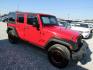 2017 Red Jeep Wrangler Unlimited Sport 4WD (1C4BJWDG5HL) with an 3.6L V6 DOHC 24V FFV engine, Automatic transmission, located at 15016 S Hwy 231, Midland City, AL, 36350, (334) 983-3001, 31.306210, -85.495277 - Photo#0