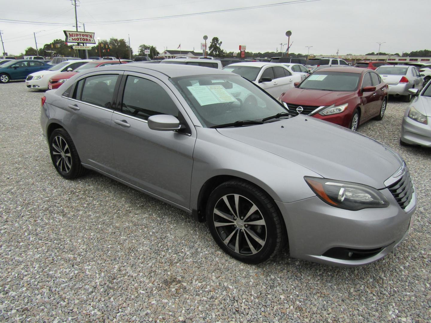 2013 Silver Chrysler 200 Touring (1C3CCBBG4DN) with an 3.6L V6 DOHC 24V FFV engine, Automatic transmission, located at 15016 S Hwy 231, Midland City, AL, 36350, (334) 983-3001, 31.306210, -85.495277 - Photo#0