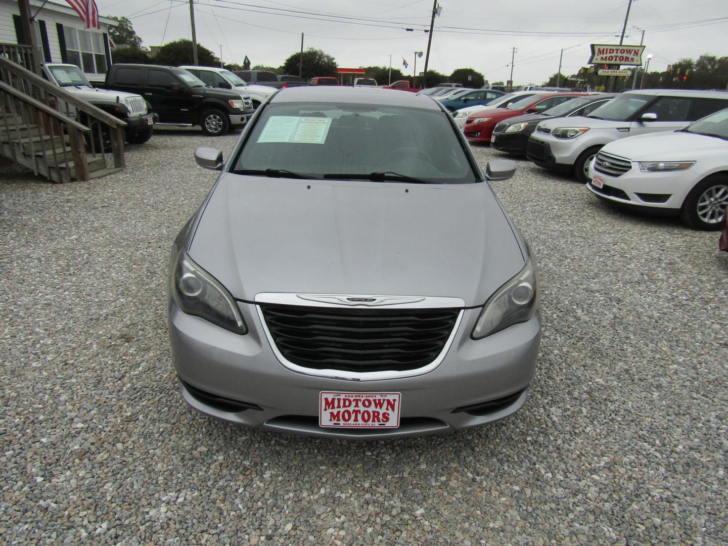 2013 Silver Chrysler 200 Touring (1C3CCBBG4DN) with an 3.6L V6 DOHC 24V FFV engine, Automatic transmission, located at 15016 S Hwy 231, Midland City, AL, 36350, (334) 983-3001, 31.306210, -85.495277 - Photo#1