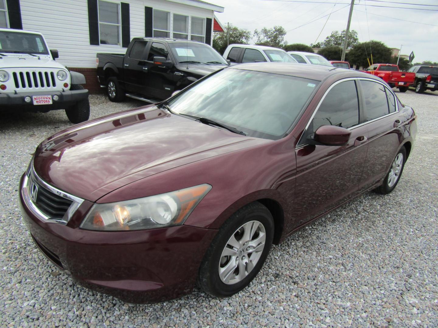 2009 Red Honda Accord LX-P Sedan AT (1HGCP26449A) with an 2.4L L4 DOHC 16V engine, Automatic transmission, located at 15016 S Hwy 231, Midland City, AL, 36350, (334) 983-3001, 31.306210, -85.495277 - Photo#2