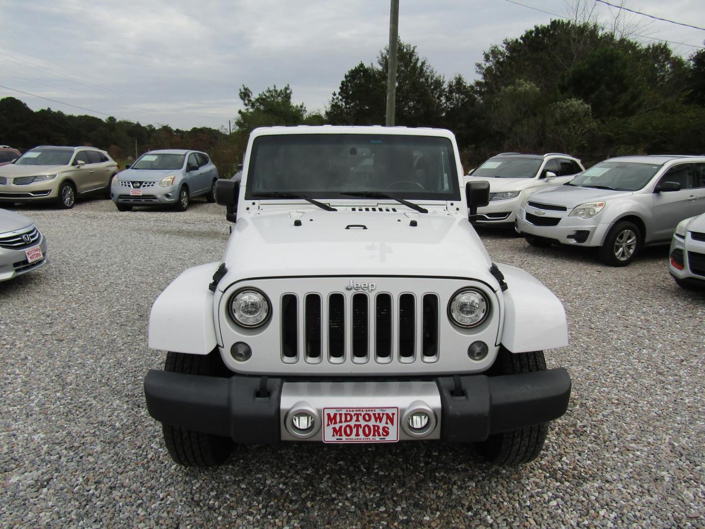 2017 White Jeep Wrangler Unlimited Sahara 4WD (1C4BJWEG0HL) with an 3.6L V6 DOHC 24V FFV engine, Automatic transmission, located at 15016 S Hwy 231, Midland City, AL, 36350, (334) 983-3001, 31.306210, -85.495277 - Photo#1