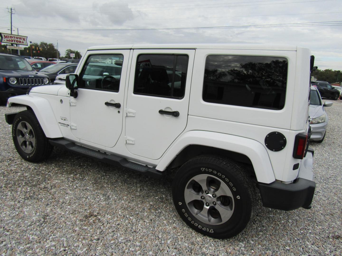 2017 White Jeep Wrangler Unlimited Sahara 4WD (1C4BJWEG0HL) with an 3.6L V6 DOHC 24V FFV engine, Automatic transmission, located at 15016 S Hwy 231, Midland City, AL, 36350, (334) 983-3001, 31.306210, -85.495277 - Photo#5