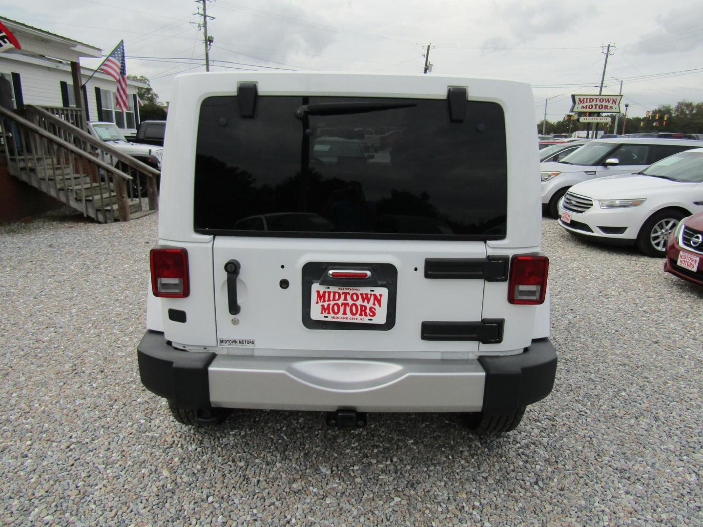 2017 White Jeep Wrangler Unlimited Sahara 4WD (1C4BJWEG0HL) with an 3.6L V6 DOHC 24V FFV engine, Automatic transmission, located at 15016 S Hwy 231, Midland City, AL, 36350, (334) 983-3001, 31.306210, -85.495277 - Photo#6