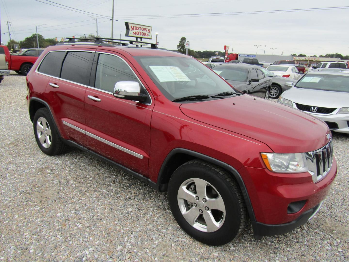 2011 Red Jeep Grand Cherokee Limited 2WD (1J4RS5GG5BC) with an 3.6L V6 DOHC 24V engine, Automatic transmission, located at 15016 S Hwy 231, Midland City, AL, 36350, (334) 983-3001, 31.306210, -85.495277 - Photo#0